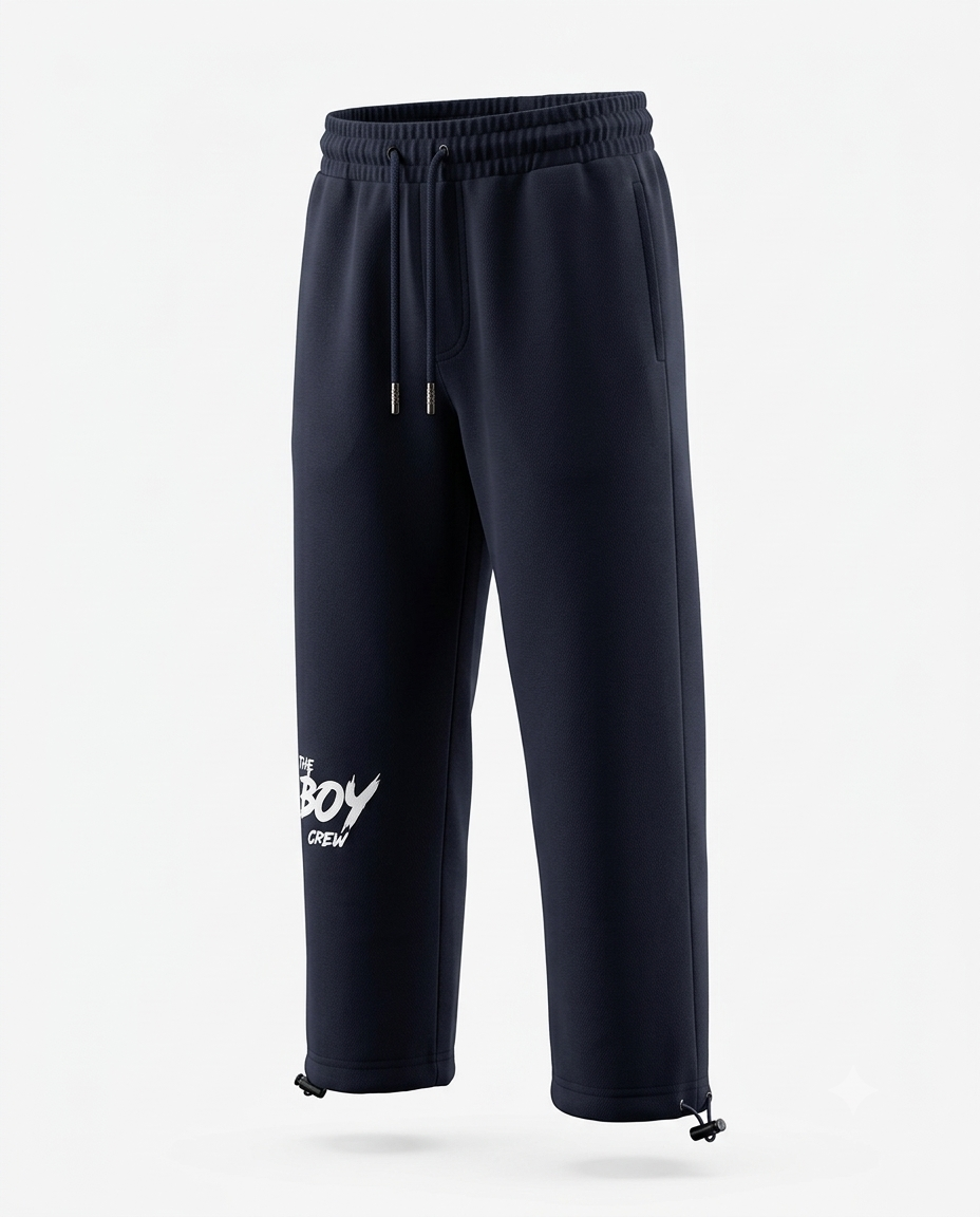 Navy The Boy Crew streetwear joggers with drawstring waist, side pockets, white logo print, and adjustable ankle toggles