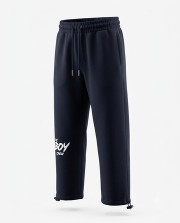 Navy The Boy Crew streetwear joggers with drawstring waist, side pockets, white logo print, and adjustable ankle toggles
