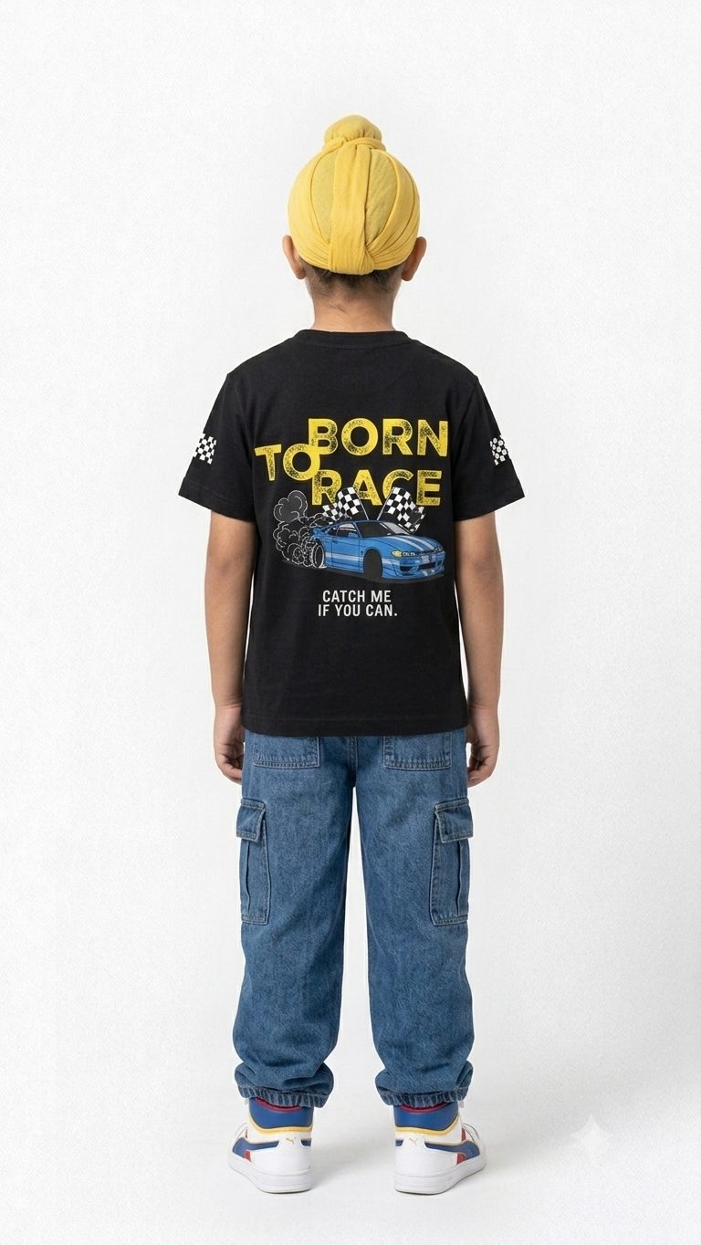 Back view of boy in black tee featuring bold 'Born To Race' yellow text, blue racing car, and 'Catch Me If You Can' print